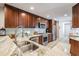 Well-equipped kitchen with stainless appliances, marble countertops, and ample cabinet space at 17537 Fairmeadow Dr, Tampa, FL 33647