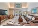 The living room features high ceilings, tile floors, and a view of the backyard at 17537 Fairmeadow Dr, Tampa, FL 33647