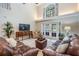 The living room features tall ceilings, tile floors, and backyard access at 17537 Fairmeadow Dr, Tampa, FL 33647
