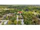 A beautiful aerial view of the property and the surrounding neighborhood, including lush greenery at 1905 Oro Ct, Clearwater, FL 33764