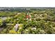Beautiful view of a neighborhood surrounded by lush greenery and a nearby lake at 1905 Oro Ct, Clearwater, FL 33764