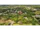 Scenic aerial view highlighting property location amidst mature trees and neighborhood setting at 1905 Oro Ct, Clearwater, FL 33764