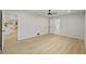 Large bedroom featuring wood-look tile flooring, and access to an ensuite bathroom at 1905 Oro Ct, Clearwater, FL 33764