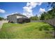 Spacious backyard with a covered patio, perfect for entertaining and relaxing outdoors at 19278 Roseate Dr, Lutz, FL 33558