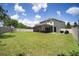 Expansive backyard with a screened lanai, offering plenty of room for recreation and relaxation at 19278 Roseate Dr, Lutz, FL 33558