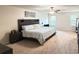 Spacious bedroom with ceiling fan, large bed with decorative pillows and headboard at 19278 Roseate Dr, Lutz, FL 33558