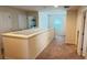 Second floor hallway with neutral walls and carpet and view of laundry room at 19278 Roseate Dr, Lutz, FL 33558