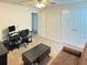 Office space with futon, desk, and doorway, offering flexibility and functionality at 19278 Roseate Dr, Lutz, FL 33558