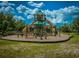 A fantastic community playground featuring multiple slides and climbing structures, perfect for fun at 19278 Roseate Dr, Lutz, FL 33558