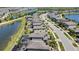 Aerial view displaying homes next to a tranquil waterway, complemented by beautiful green spaces and landscaping at 19796 Long Lake Ranch Blvd, Lutz, FL 33558