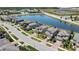 Aerial shot showcases homes along the tranquil pond, highlighting the attractive neighborhood layout at 19796 Long Lake Ranch Blvd, Lutz, FL 33558