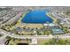 An aerial image of a neighborhood that includes a lake, pool, playground and tennis court at 19796 Long Lake Ranch Blvd, Lutz, FL 33558