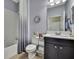 Modern bathroom with a shower and tub combination, updated fixtures, and stylish mirror at 19796 Long Lake Ranch Blvd, Lutz, FL 33558