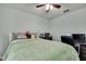 Comfortable bedroom featuring neutral walls, ceiling fan, and a cozy bedspread at 19796 Long Lake Ranch Blvd, Lutz, FL 33558