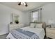 Bedroom with wood look floors, ceiling fan, and natural light at 19796 Long Lake Ranch Blvd, Lutz, FL 33558