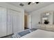 Bedroom with wood look floors and plenty of closet space at 19796 Long Lake Ranch Blvd, Lutz, FL 33558