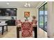 Bright dining area features tile floors, slider access to the yard, and a modern chandelier at 19796 Long Lake Ranch Blvd, Lutz, FL 33558