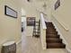 Bright entryway with staircase and views into the living areas at 19796 Long Lake Ranch Blvd, Lutz, FL 33558