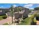 Beautiful two-story home with lush landscaping, a brick driveway, and a welcoming front entrance, enhancing curb appeal at 19796 Long Lake Ranch Blvd, Lutz, FL 33558