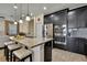 Modern kitchen with granite countertops, stainless steel appliances, and a large island with seating at 19796 Long Lake Ranch Blvd, Lutz, FL 33558
