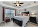 Cozy main bedroom with tray ceiling, bedside lamps, soft lighting and luxury vinyl floors at 19796 Long Lake Ranch Blvd, Lutz, FL 33558