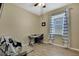 Bright office space featuring desk, chair, ceiling fan, and a window with coverings at 19796 Long Lake Ranch Blvd, Lutz, FL 33558