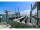 Up close view of the boat lift with waterfront living at 213 Harrison Ave, Belleair Beach, FL 33786