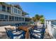 Backyard pool and patio with an outdoor dining table at 213 Harrison Ave, Belleair Beach, FL 33786