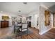 Dining room with chandelier lighting, seating for six, water view, and access to the outdoor space at 213 Harrison Ave, Belleair Beach, FL 33786