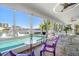 Bright dining room with pool and water views and unique decor at 213 Harrison Ave, Belleair Beach, FL 33786