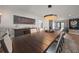 Spacious dining room features modern chandelier lighting, a large table with seating, and stylish decor at 213 Harrison Ave, Belleair Beach, FL 33786