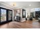 Elegant foyer with stylish wallpaper and double door entry at 213 Harrison Ave, Belleair Beach, FL 33786