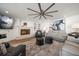 Inviting living room featuring a fireplace, a large area rug and comfortable furnishings at 213 Harrison Ave, Belleair Beach, FL 33786