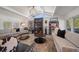 Living room features high ceilings, unique decor, lots of natural light, and elegant furnishings at 213 Harrison Ave, Belleair Beach, FL 33786