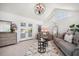 Bright living room with seating area, modern decor, and balcony access at 213 Harrison Ave, Belleair Beach, FL 33786