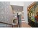Staircase showcasing wallpaper, hardwood floors, and decorative details at 213 Harrison Ave, Belleair Beach, FL 33786