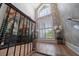 Staircase featuring high ceilings, wallpaper, and a large window at 213 Harrison Ave, Belleair Beach, FL 33786