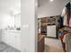 Well-organized walk-in closet with custom shelving, shoe racks, and rods for efficient storage solutions at 213 Harrison Ave, Belleair Beach, FL 33786