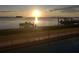 Lovely waterfront view with boat lift at sunrise at 2172 Harbor View Dr, Dunedin, FL 34698