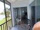 Relaxing screened balcony view overlooking the lake with seating for outdoor enjoyment at 224 Cypress Ln # 224, Oldsmar, FL 34677