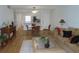 Bright, open-concept living room and dining area with hardwood floors and modern furnishings at 224 Cypress Ln # 224, Oldsmar, FL 34677