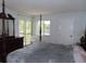 Inviting bedroom featuring a four-poster bed and peaceful water views from the windows at 224 Cypress Ln # 224, Oldsmar, FL 34677
