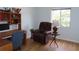 Bright office with desk, comfortable chair, and natural light streaming through the window at 224 Cypress Ln # 224, Oldsmar, FL 34677