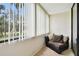 Cozy balcony featuring comfortable seating, offering a quiet and relaxing retreat with natural light at 2614 Cove Cay Dr # 207, Clearwater, FL 33760