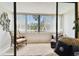Relaxing balcony retreat offering comfortable seating and serene views through large windows at 2614 Cove Cay Dr # 207, Clearwater, FL 33760