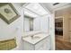 Standard bathroom featuring a marble countertop vanity, and decorative wall art at 2614 Cove Cay Dr # 207, Clearwater, FL 33760