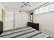 Bedroom with carpet flooring, a ceiling fan, and a built-in closet with sliding doors at 2614 Cove Cay Dr # 207, Clearwater, FL 33760