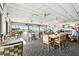 Spacious dining area overlooking the golf course with comfortable seating at 2614 Cove Cay Dr # 207, Clearwater, FL 33760