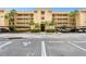 Inviting condo complex with lush landscaping and covered parking; a tropical paradise at 2614 Cove Cay Dr # 207, Clearwater, FL 33760
