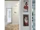 Hallway with art display leading to other rooms in the home at 2614 Cove Cay Dr # 207, Clearwater, FL 33760